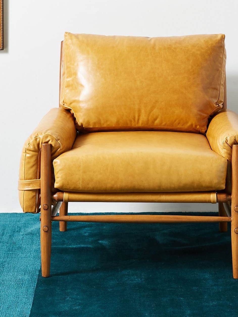 leather chair on teal rug