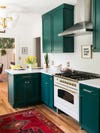 glossy green kitchen with small L-shaped counter