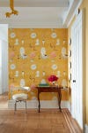 entryway with eclectic yellow wallpaper and small table