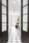hallway with checkerboard floors