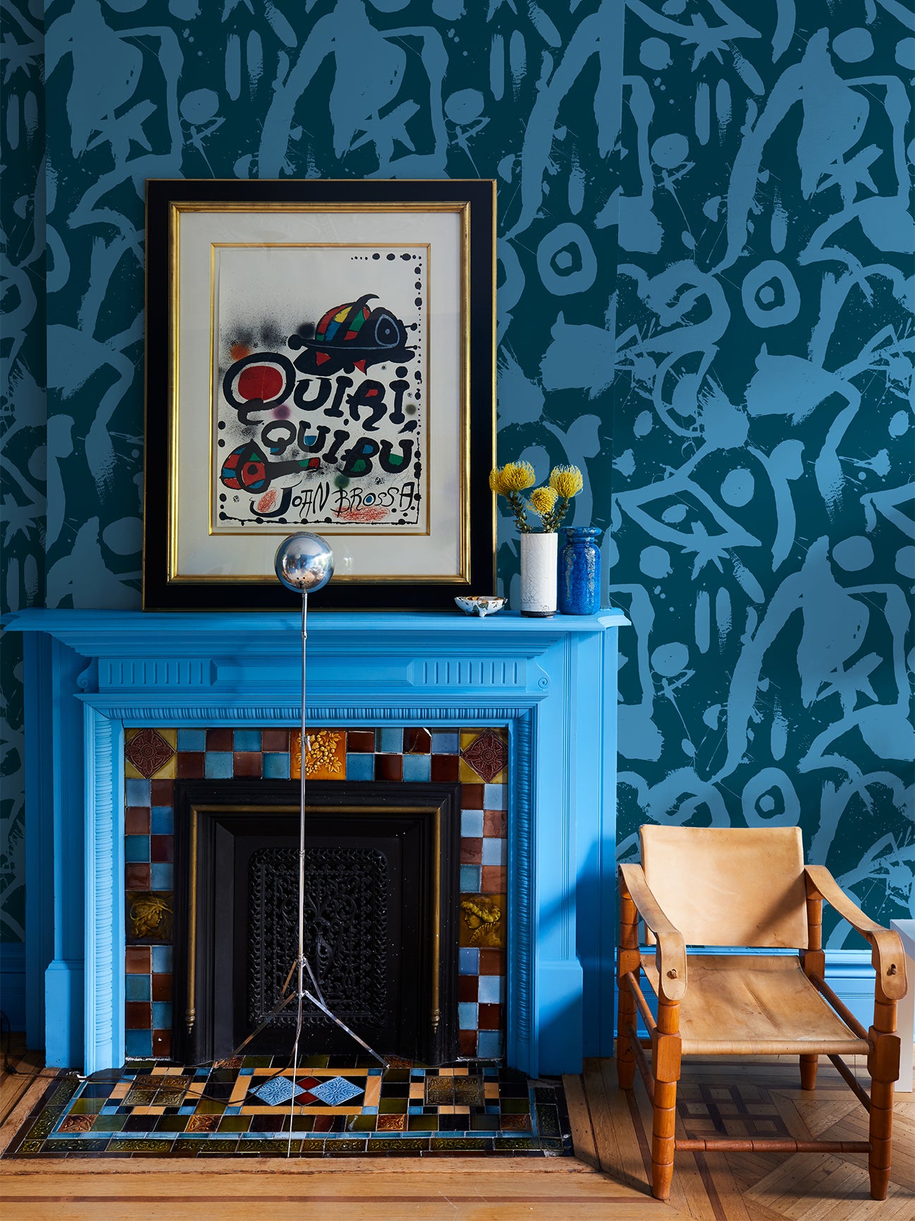 bright blue fireplace with wallpaper