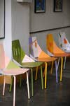 five colorful chairs in a row