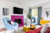bright pink fireplace in white living room