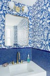blue tile bathrom with blue wallpaper
