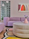 Lilac sofa and wavy rug