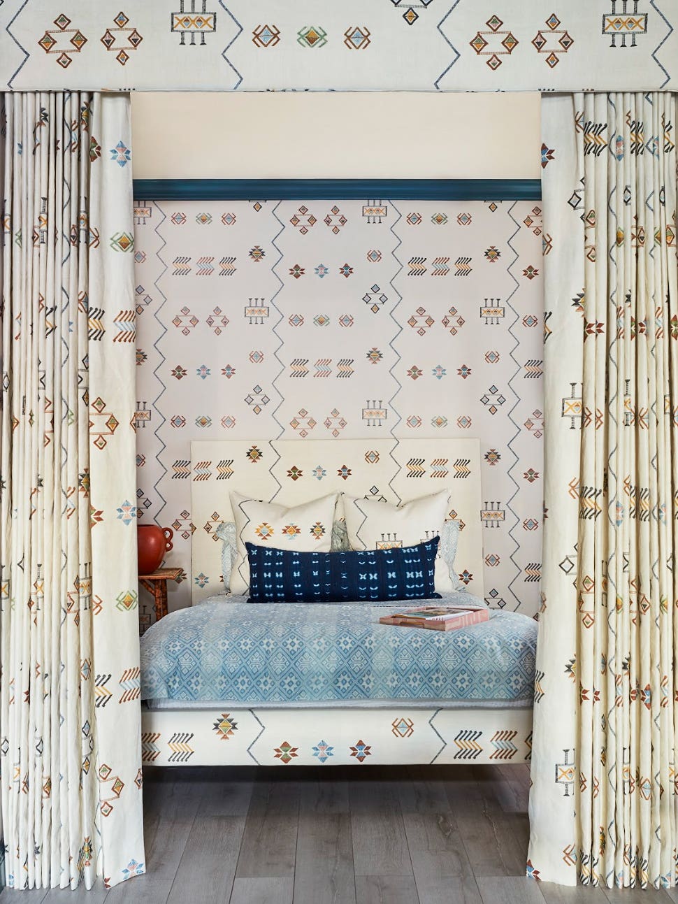 white boho canopy bed with matching wallpaper
