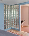 corner of a bedroom covered with glass blocks