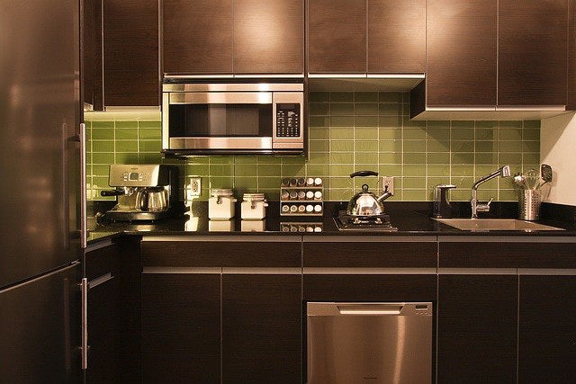 Before: kitchen with green tiles