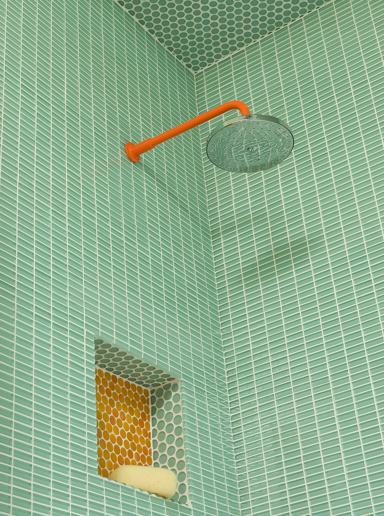 green glass tile shower with recessed nook