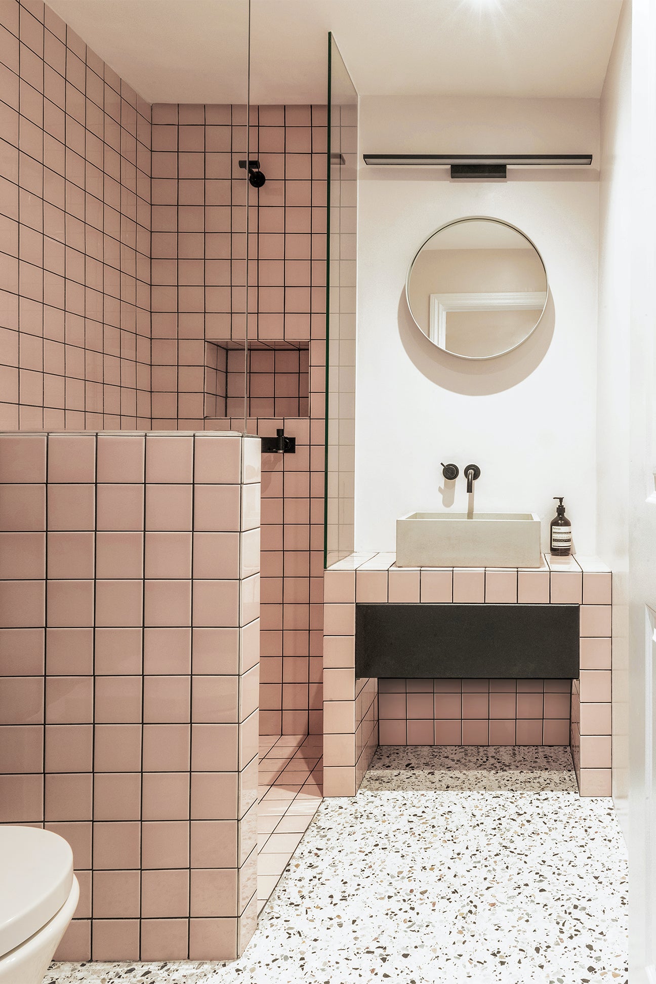 pink grid tile bathroom