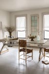 white dining room with rustic furniture