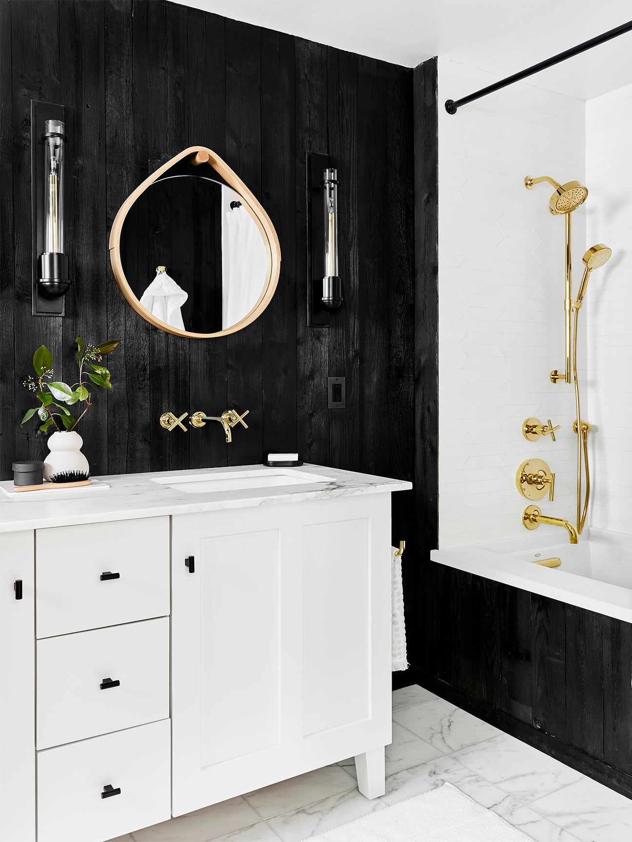 Black bathroom with gold accents