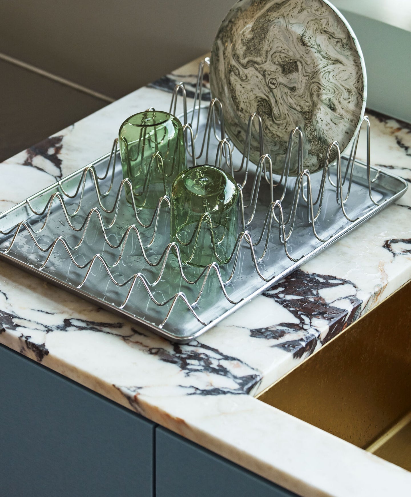 marble counter with stainless steel dish rack