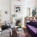 living room with purple couch and chairs