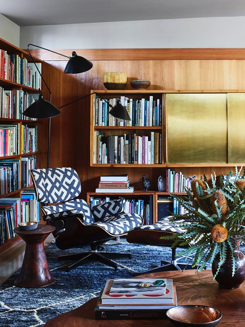 mid-century living room with brass cabinets