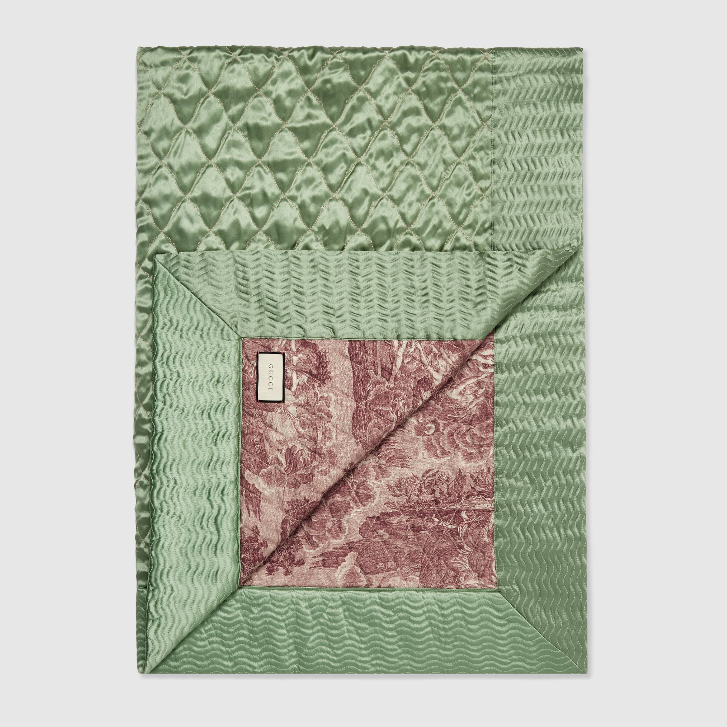 Green blanket with maroon toile lining