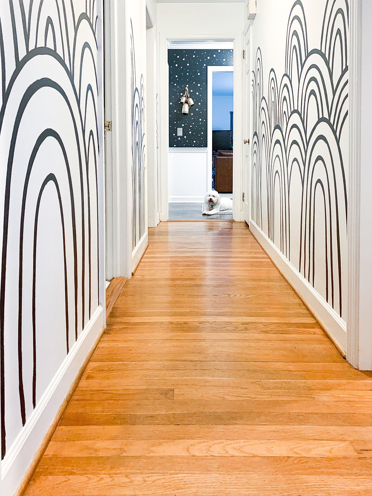 wood floor hall with wall arches