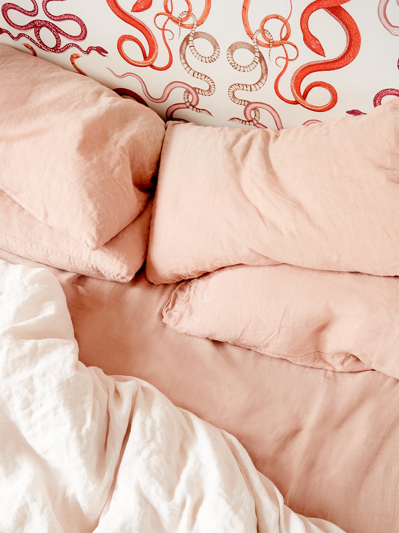 Pink bedding on bed