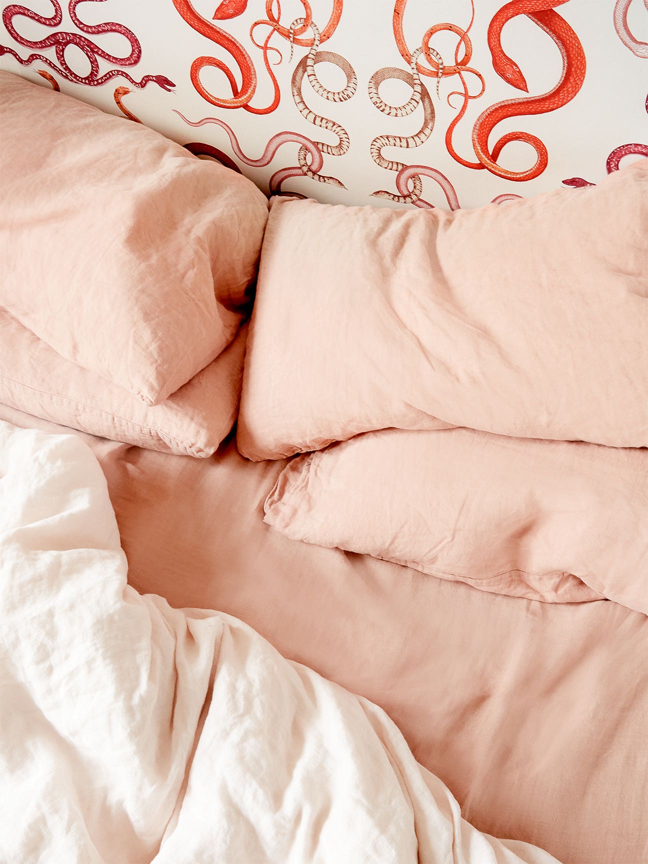 Pink bedding on bed