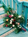colorful flowers against blue staircase