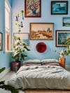 Colorful room with blue walls and bed on the floor