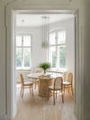 dining room nook with wooden chairs