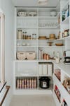 walk in pantry with baskets