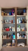 dark and unorganzied beauty cabinet
