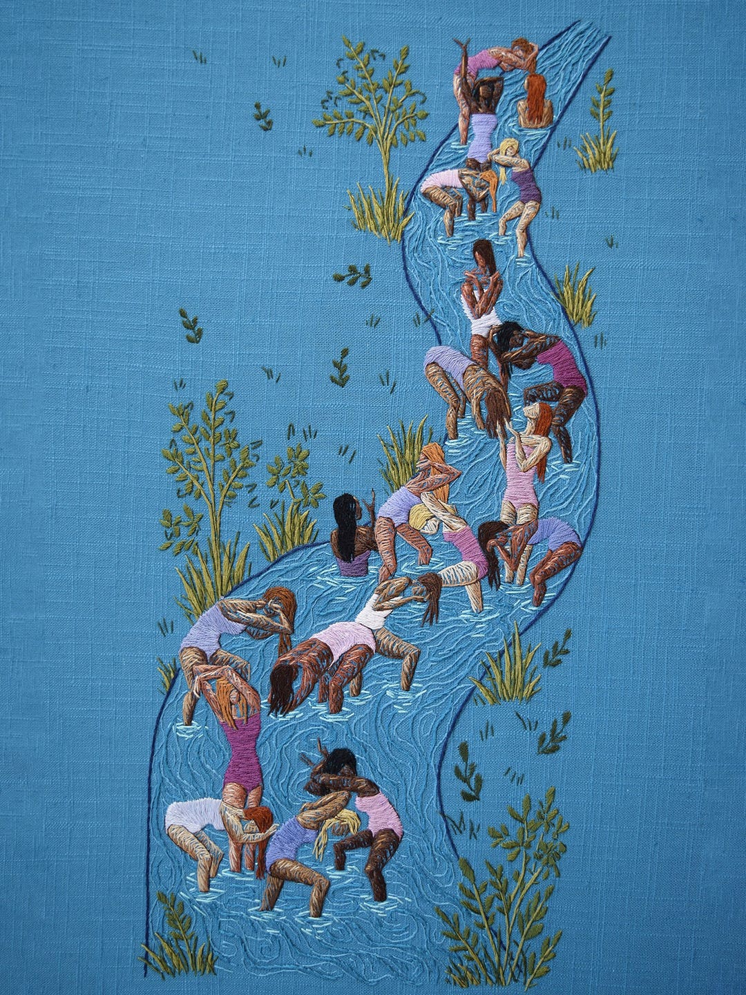 Embroidery art of women in a stream