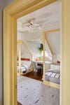 Attic Kids Room With Yellow Canopy Beds
