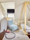 Attic Kids Room With Blue Slipper Chair