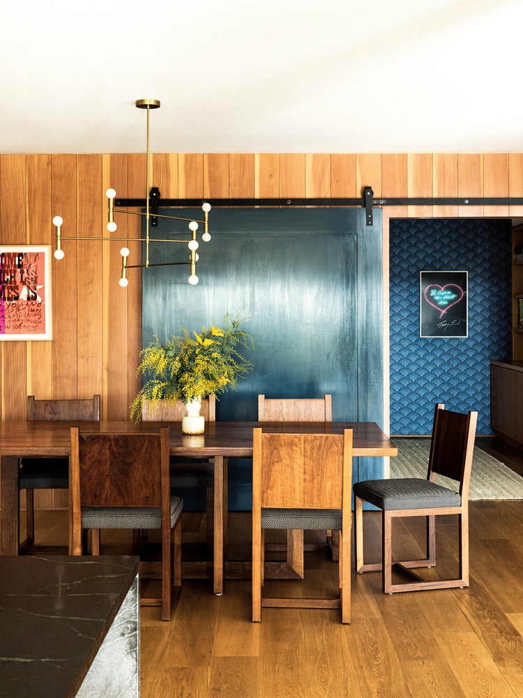 blue door in a mid century modern wood dining room