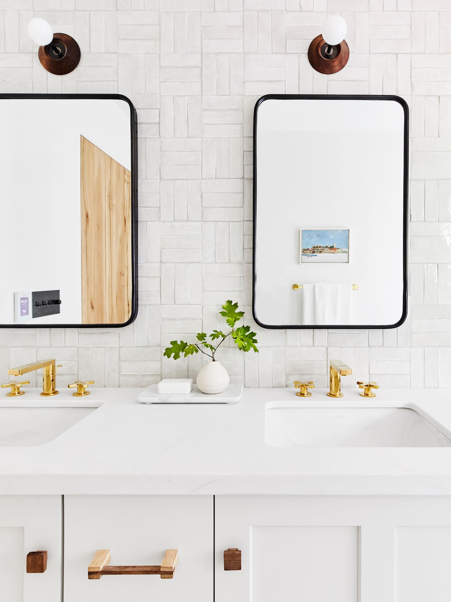 White bathroom with brass fixtures