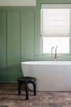 Green bedroom with soaking tub