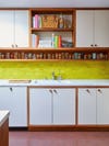 yellow tiled kitchen