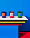 colorful candles in front of blue wall