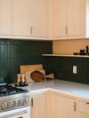 corner of kitchen wiht green tiles