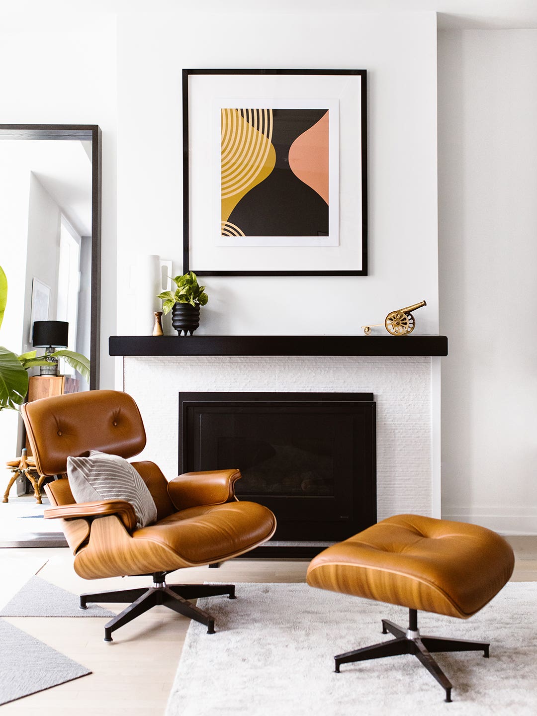 Eames chair in front of fireplace