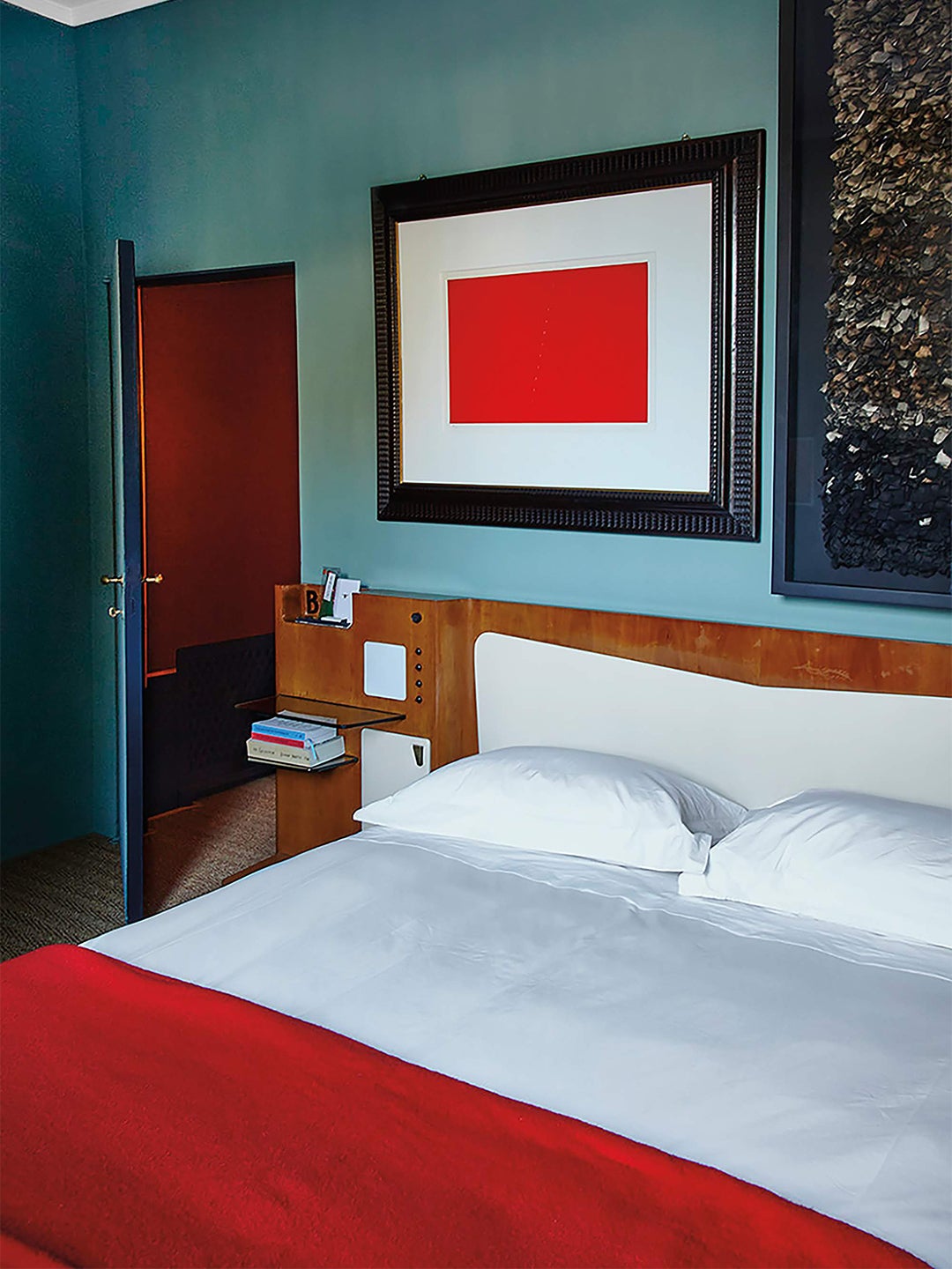 Blue bedroom with red quilt