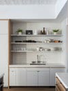 Simple white open kitchen shelving