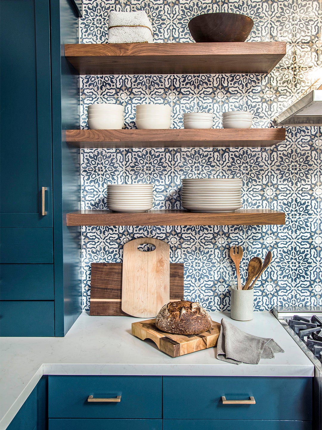 Open shelving in front of tiled walls