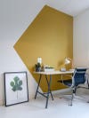 Yellow corner colorblocked wall in a home office