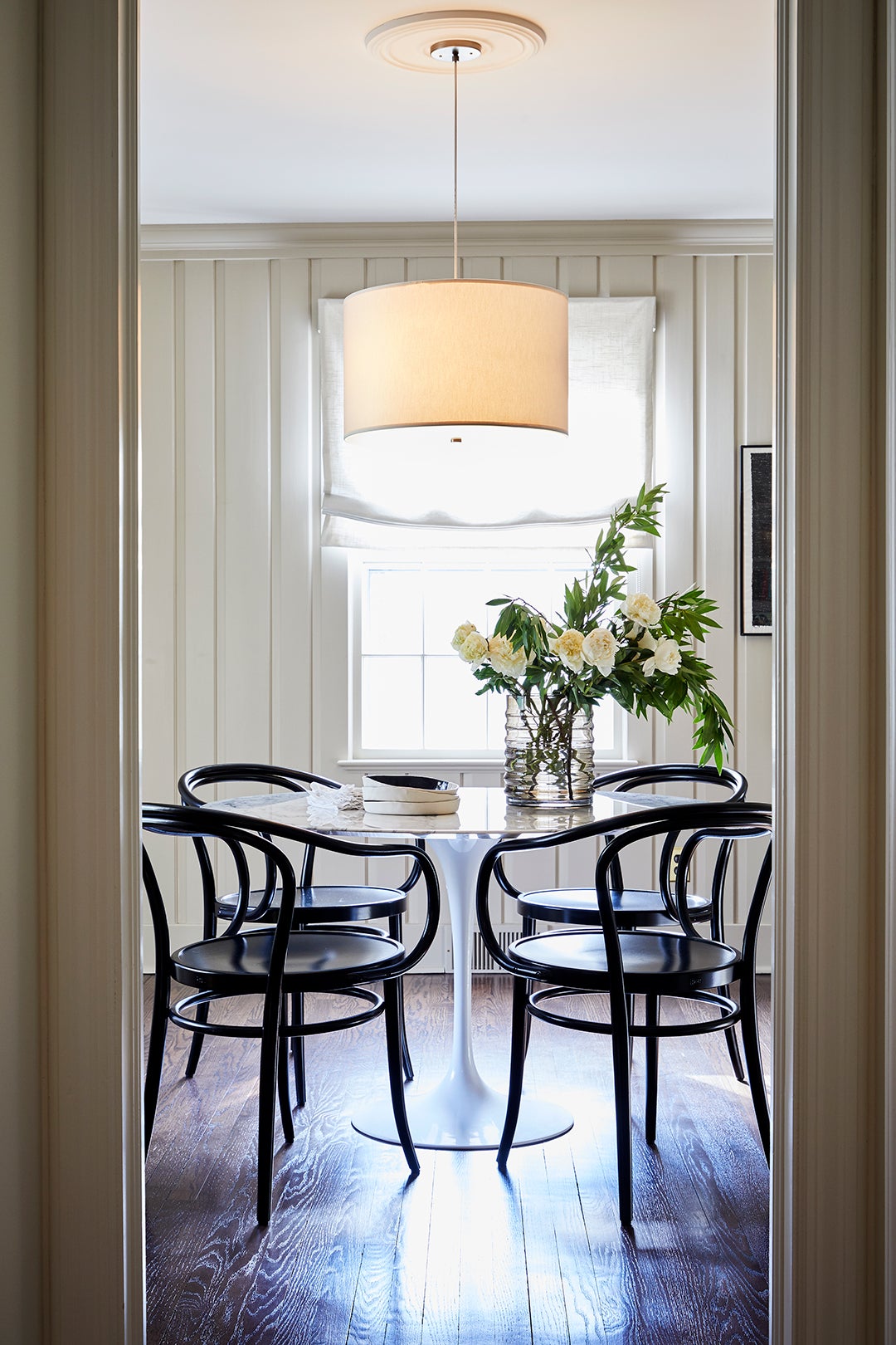dining room with black cane chairs