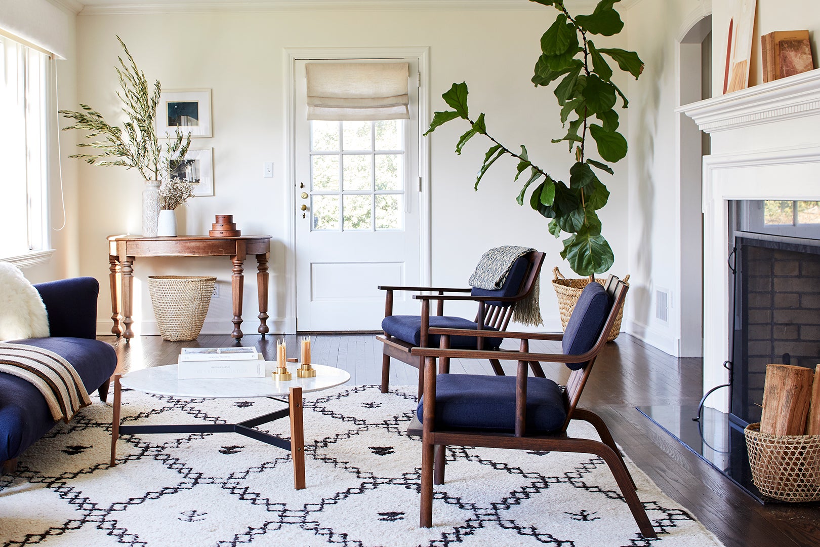 navy blue armchairs and moroccan rug