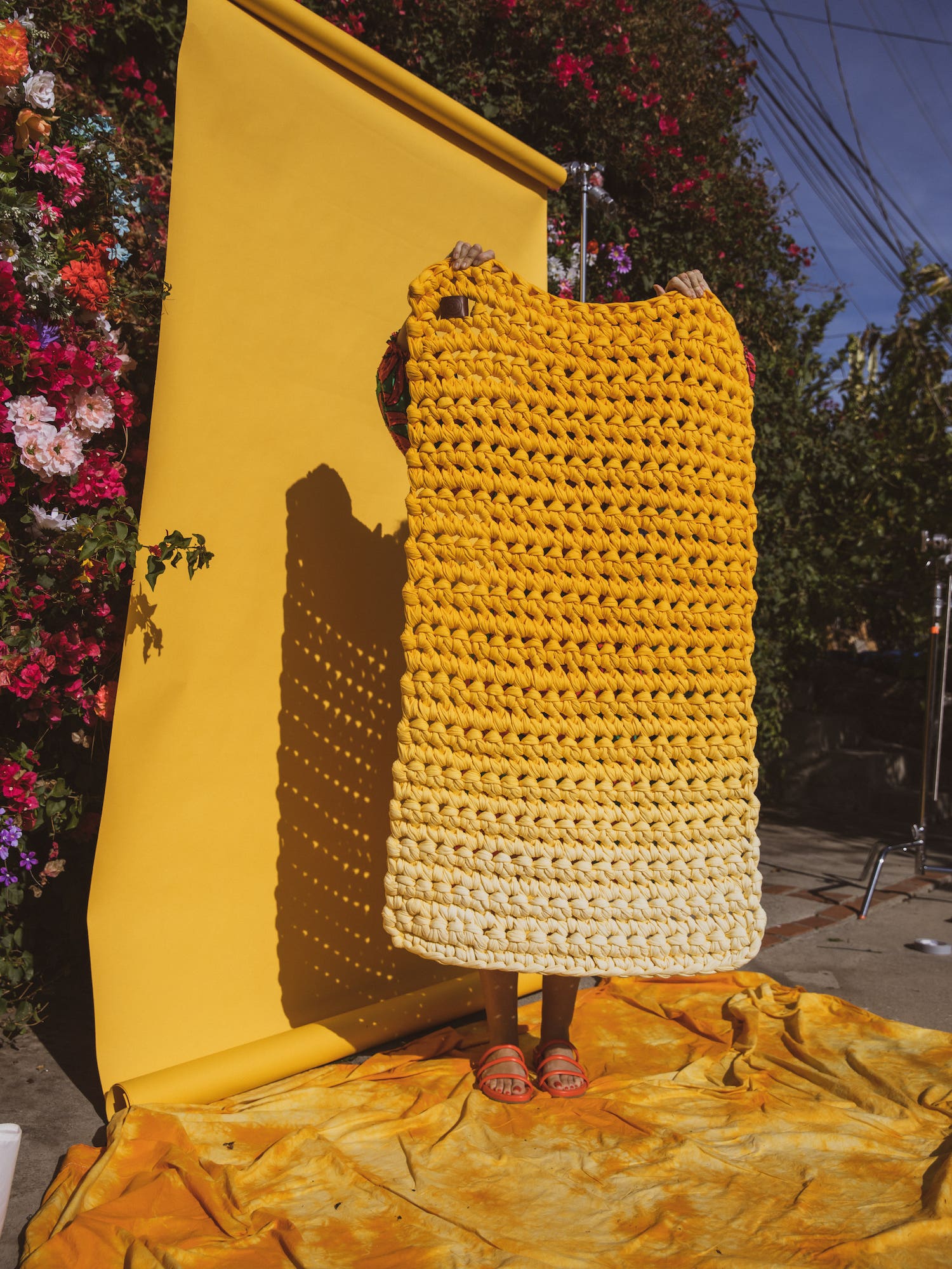 woman holding yellow blanket