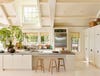 Large off-white kitchen with vaulted ceiling