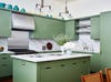 Green kitchen with white marble countertops