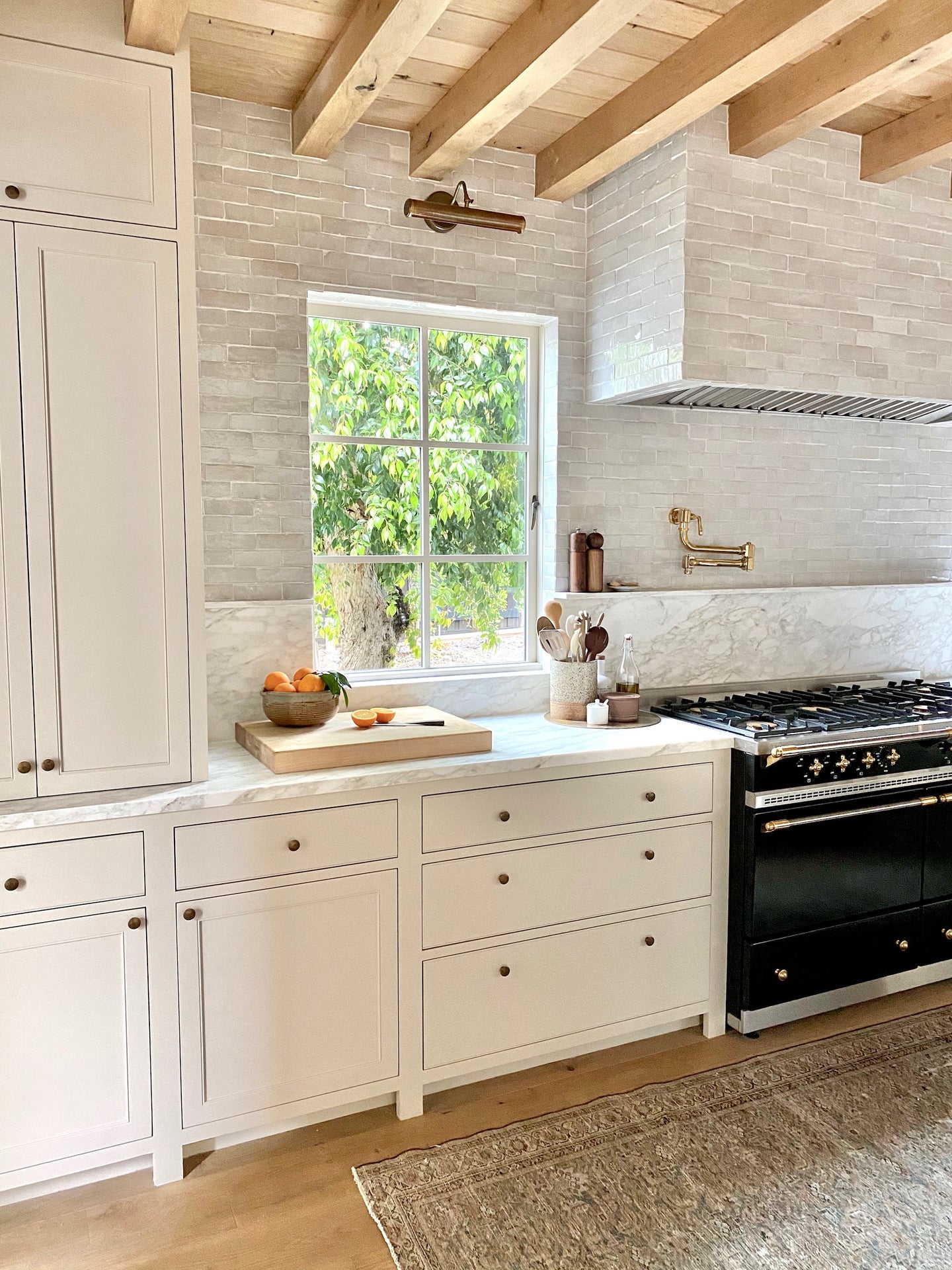 white kitchen with wooden beams
