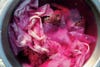 Pink fabric being dyed