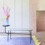 pink room with lilac and neon yellow rug